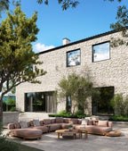 Modern outdoor seating area with a stone building in the background
