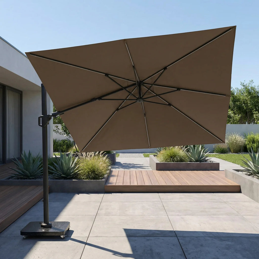 Brown patio umbrella on a stand in an outdoor setting with a house and garden in the background.