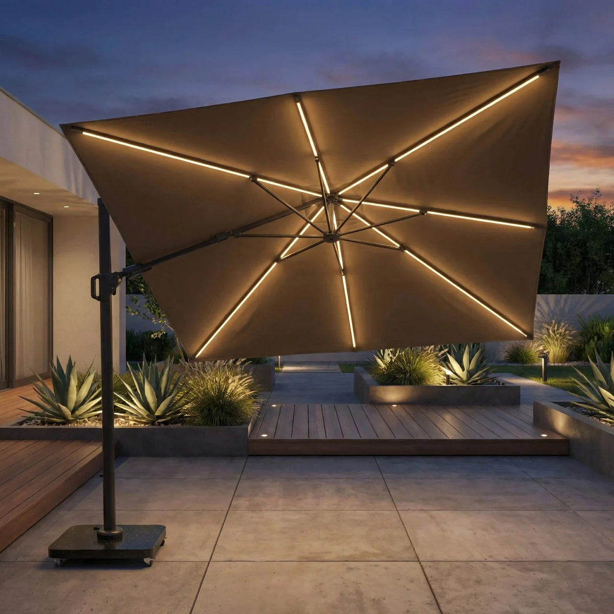 Large outdoor umbrella with LED lights in a garden setting